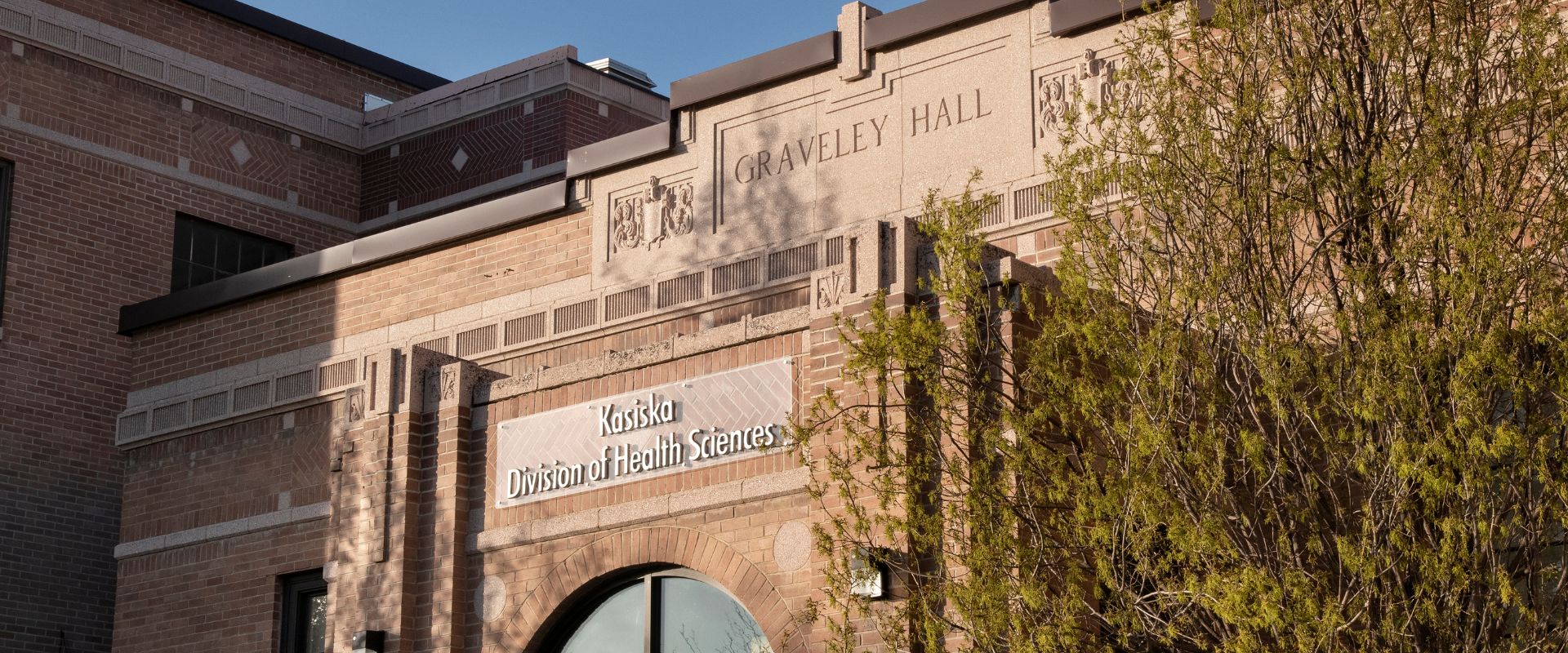 The front of the Gravely Hall building on the Pocatello Campus, a brick building with large window