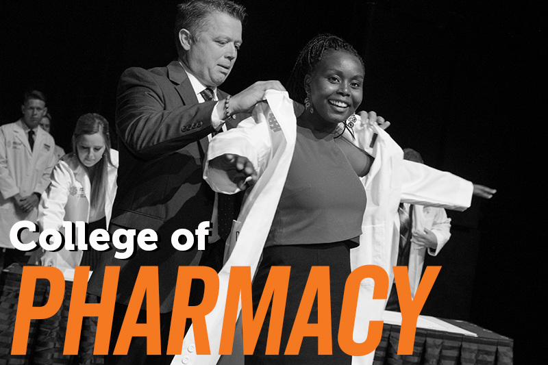 College of Pharmacy image with African American student receiving her white coat