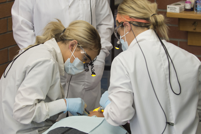 Students practicing at a dental hygiene clinic