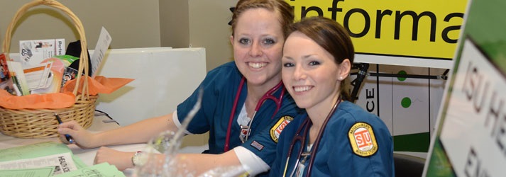 Two nursing students siting at a table