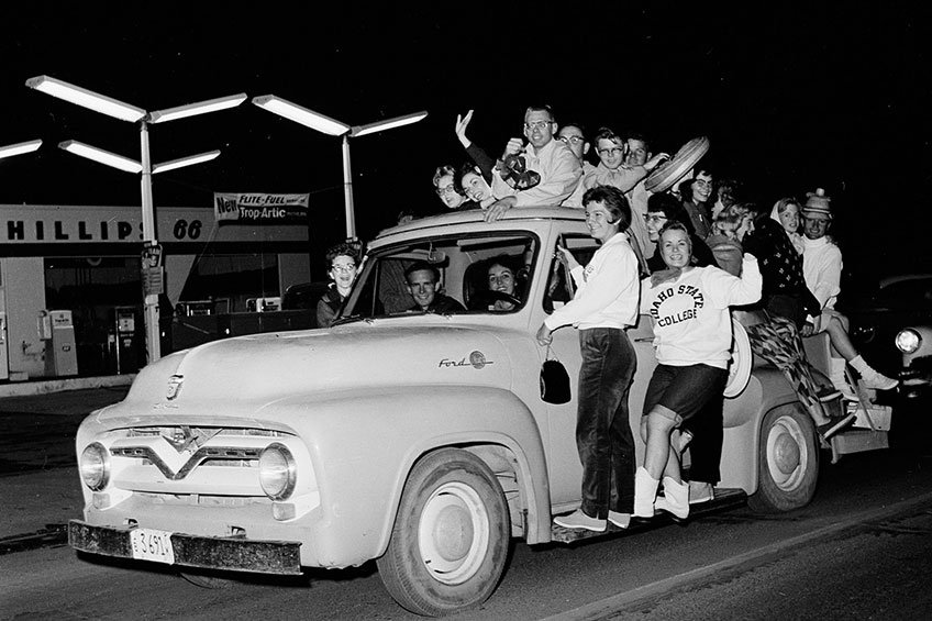 Students completely fill a truck in the parade