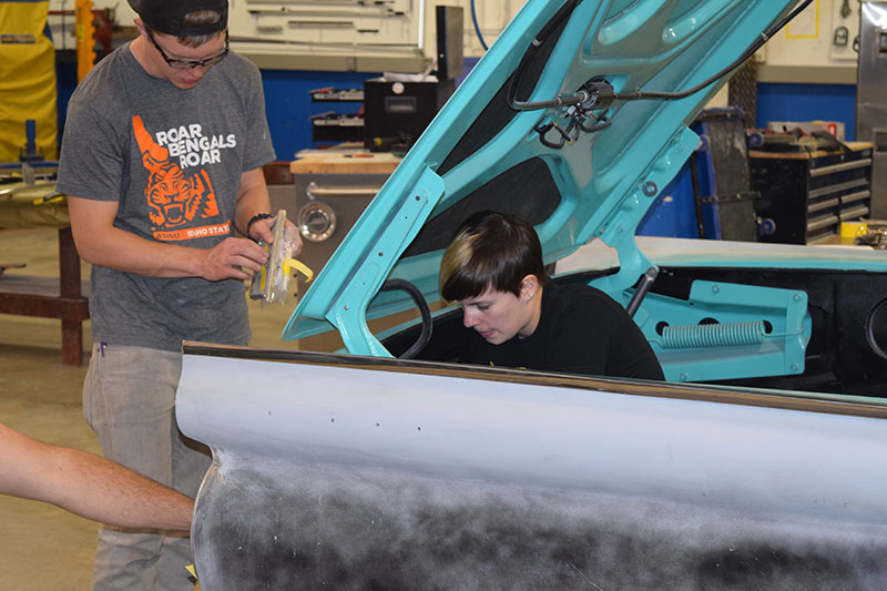 Students working on cars