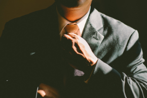 Man fixing his tie