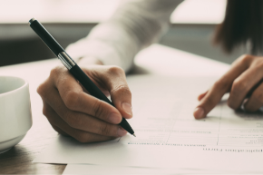 Person filling paperwork