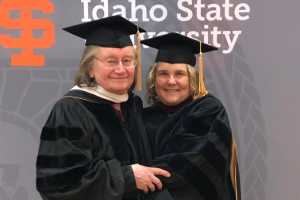 Dr. Hellwig and Dr. Hackert in commencement regalia