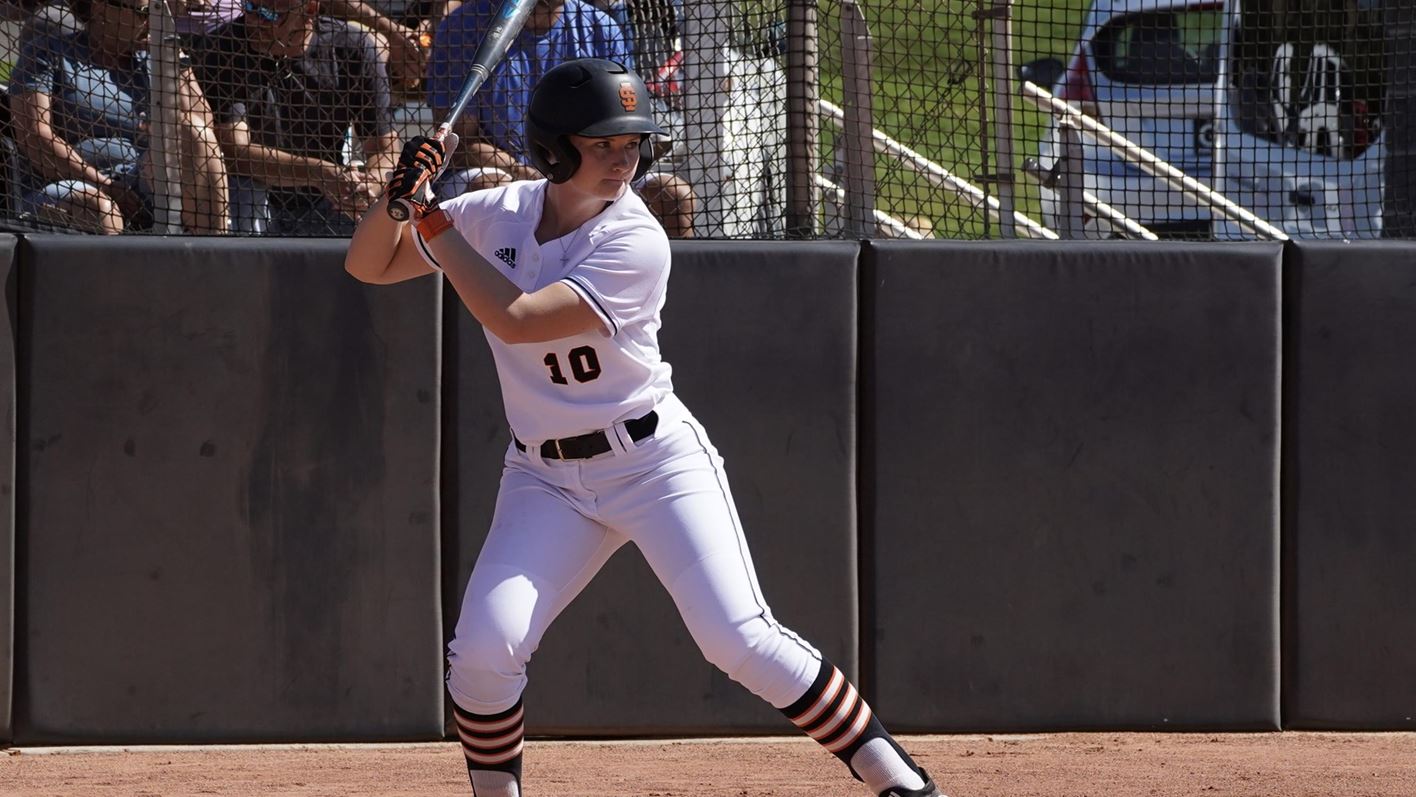 Softball player batting