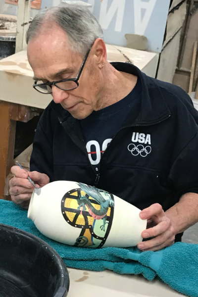 Brent Lowman painting a vase