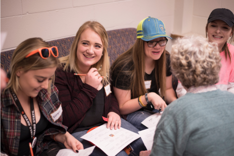 Students studying with a tutor