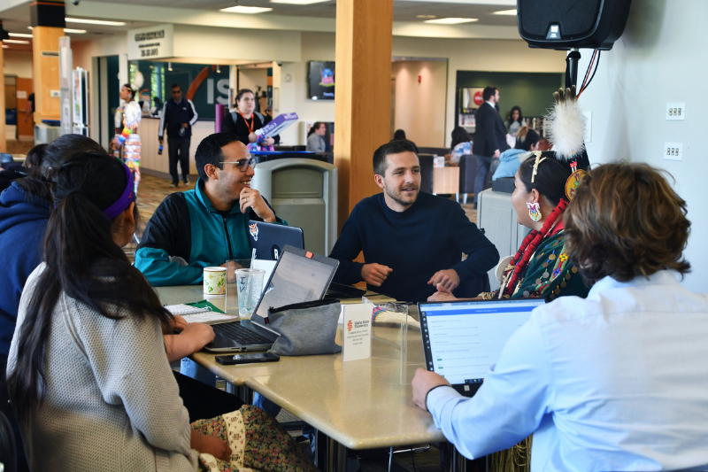 Students studying at a table in the SUB