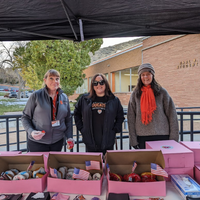 Veterans Day Donut Giveaway staff council members with donuts