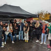 Tailgating photo with students in front of tent