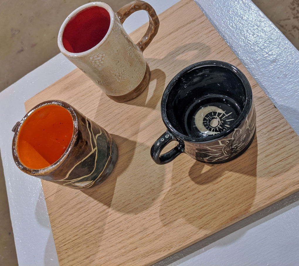 From left to right: Landscape, Berries, Sun and Moon - Stoneware clay 