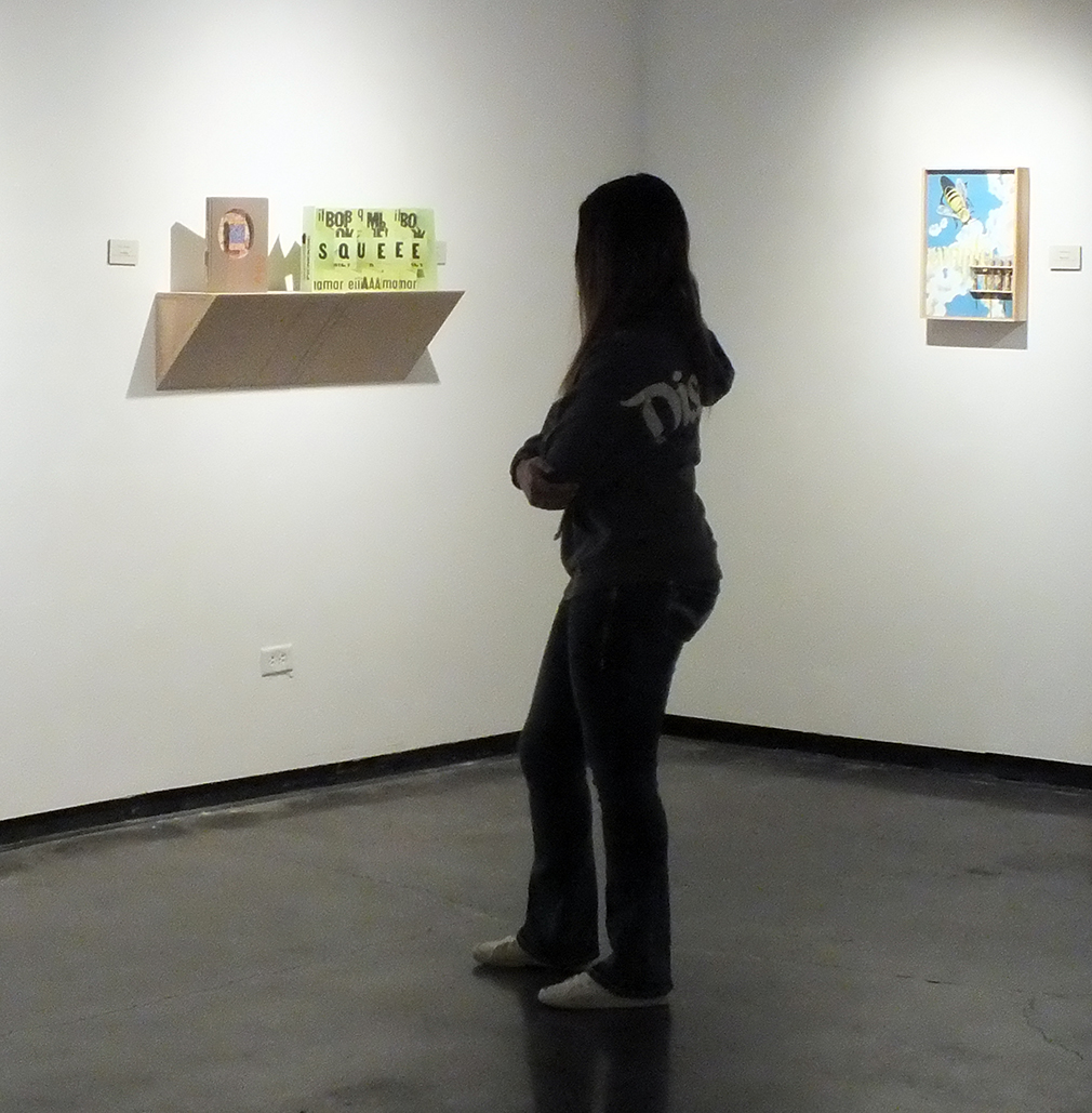 A guest of the gallery viewing the exhibition.