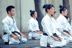 People in Karate outfits kneeling
