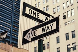 One way signs pointing in different directions