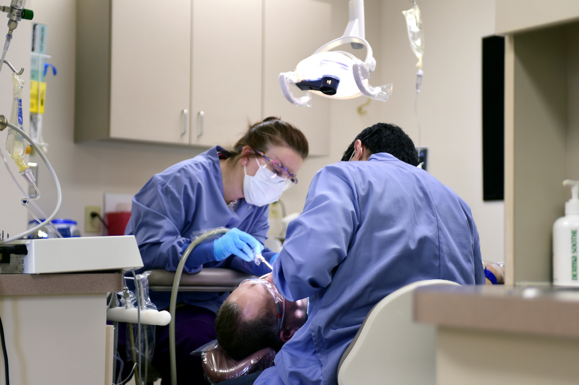 Dentist and Hygienist working on a patient