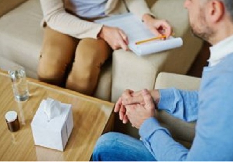 Patient reviewing health with physician