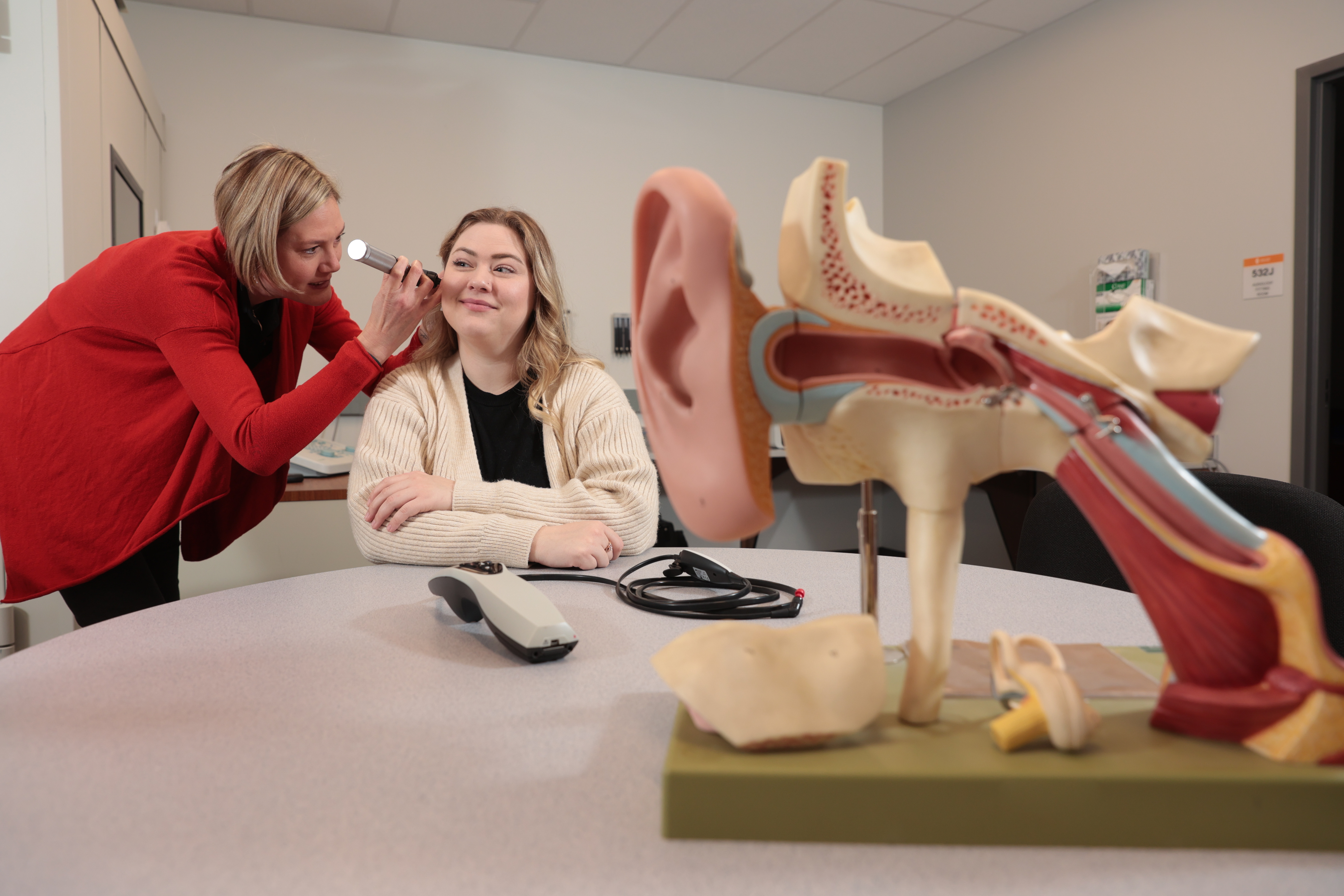 Audiologist performing and audiology exam