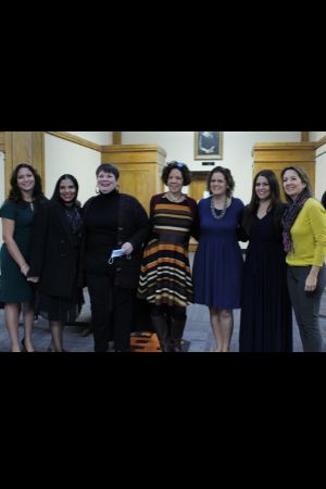 the first MA in Spanish online cohort stands in a line posing for the picture. There are 7 women in the photo, some are faculty.