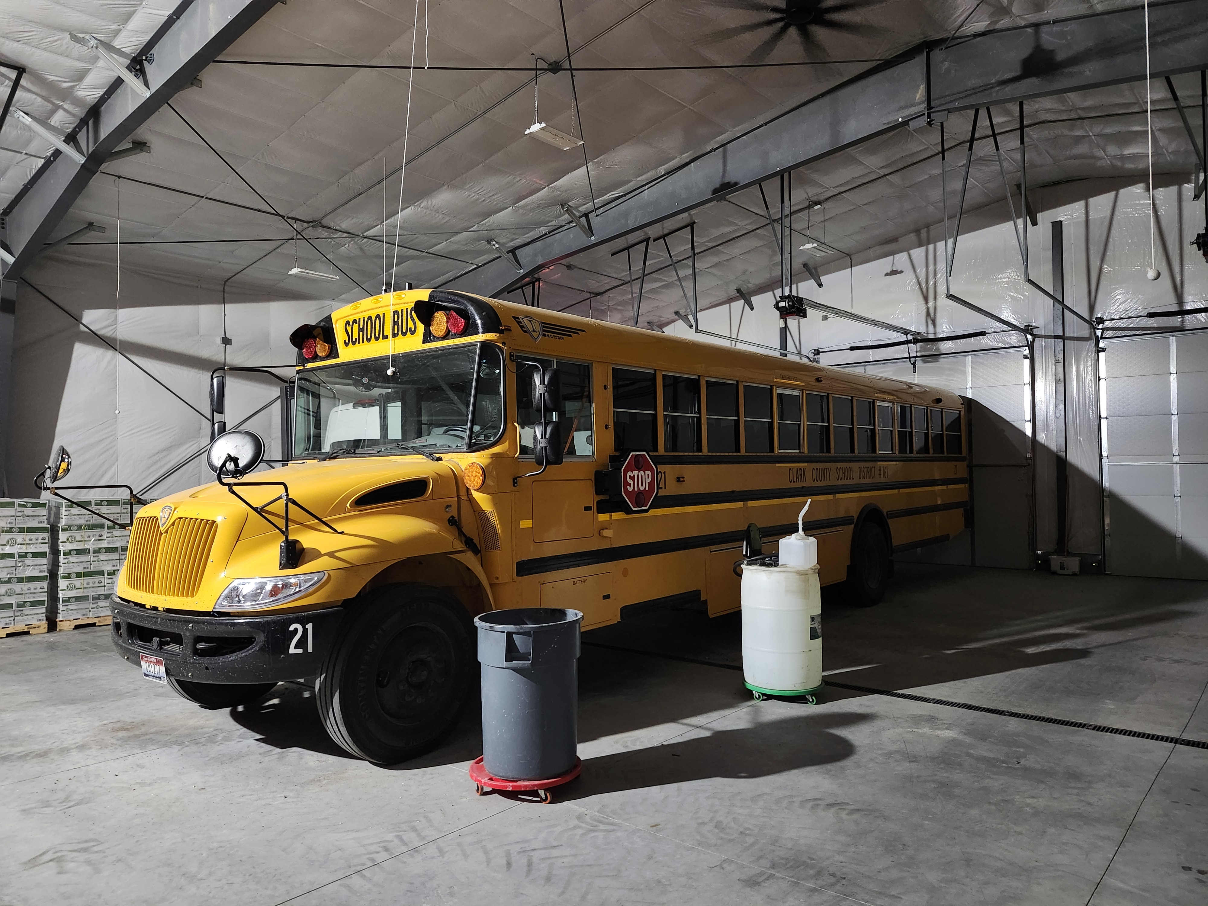 A yellow school bus driven by Superintendent Eileen Holden is parked inside the Clark County bus barn attached to the school building.