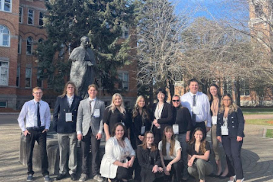 National Student Advertising Campaign team poses for a picture outside the campus