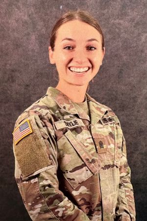 Headshot of Annika Smylie in military camo fatigues