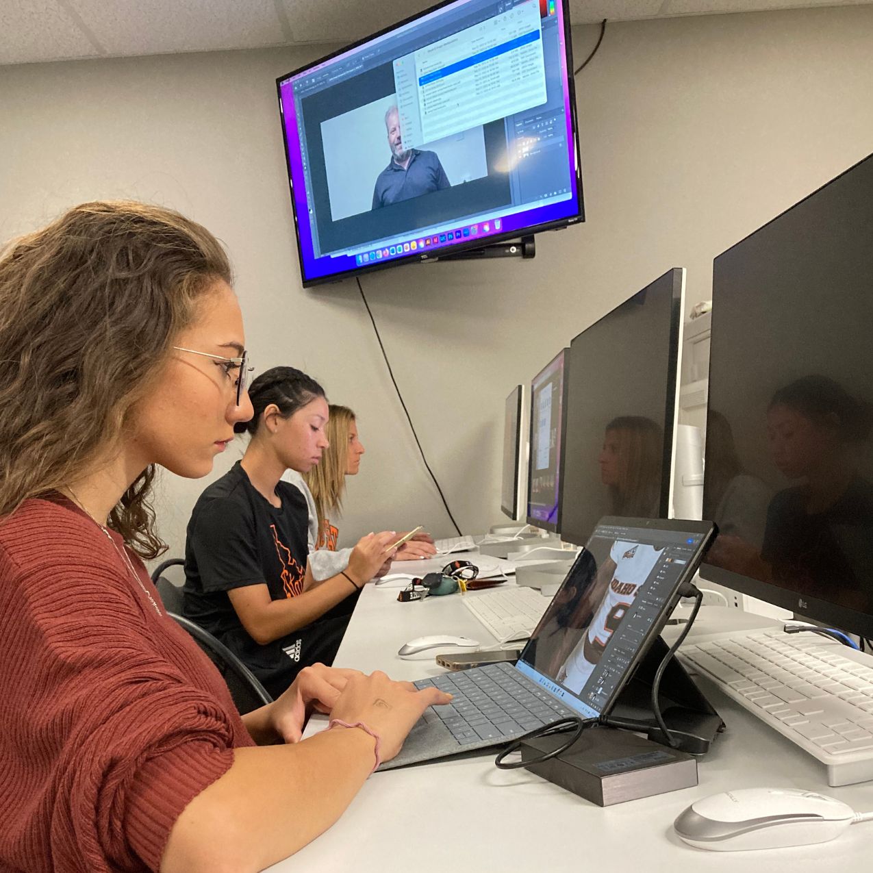 ISU students work on computers in the communications computer lab during a photoshop class taught by John Young