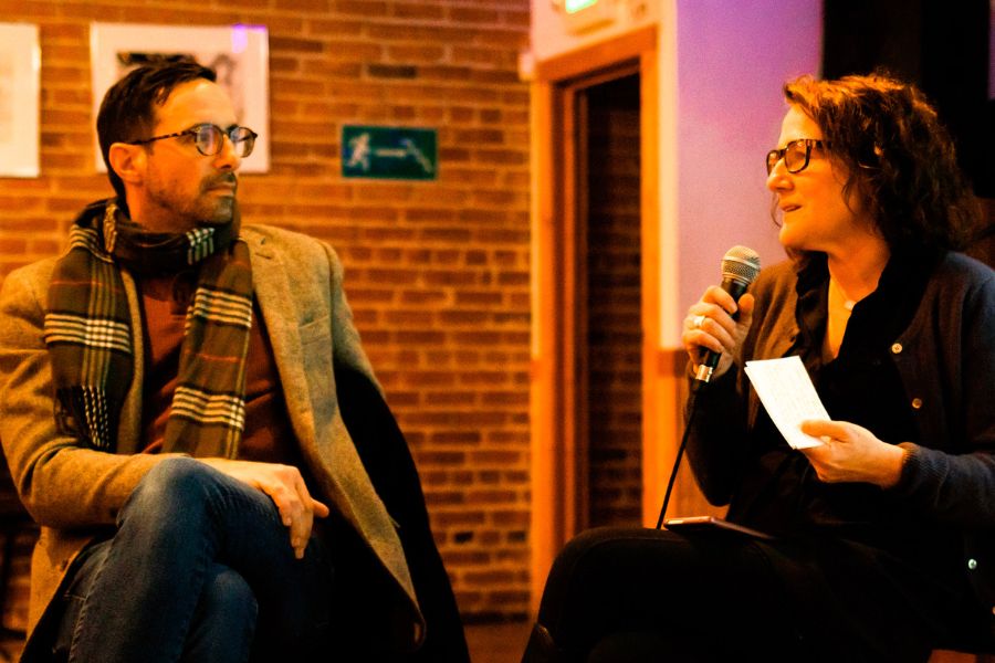 Jonathan Fardy and Aloha Young sit in discussion about art in the Portneuf Valley Brewing room