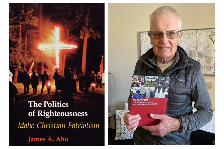 James Aho stands holding the cover of his latest book. Also pictured is the cover of his first book, which features a burning cross.