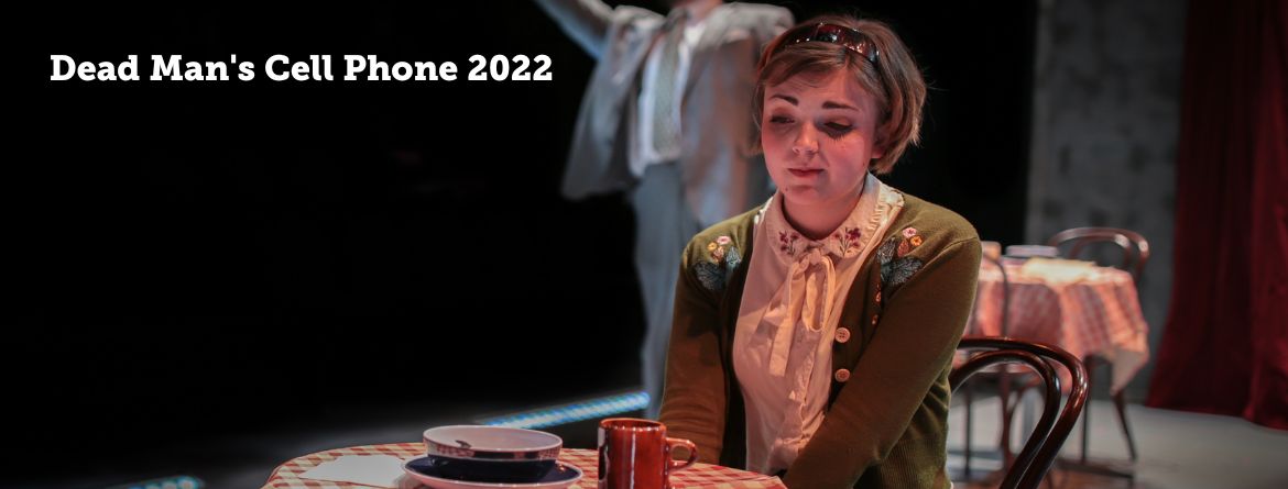 Dead Man's Cell Phone 2022 actress sits sadly alone at a table in a diner