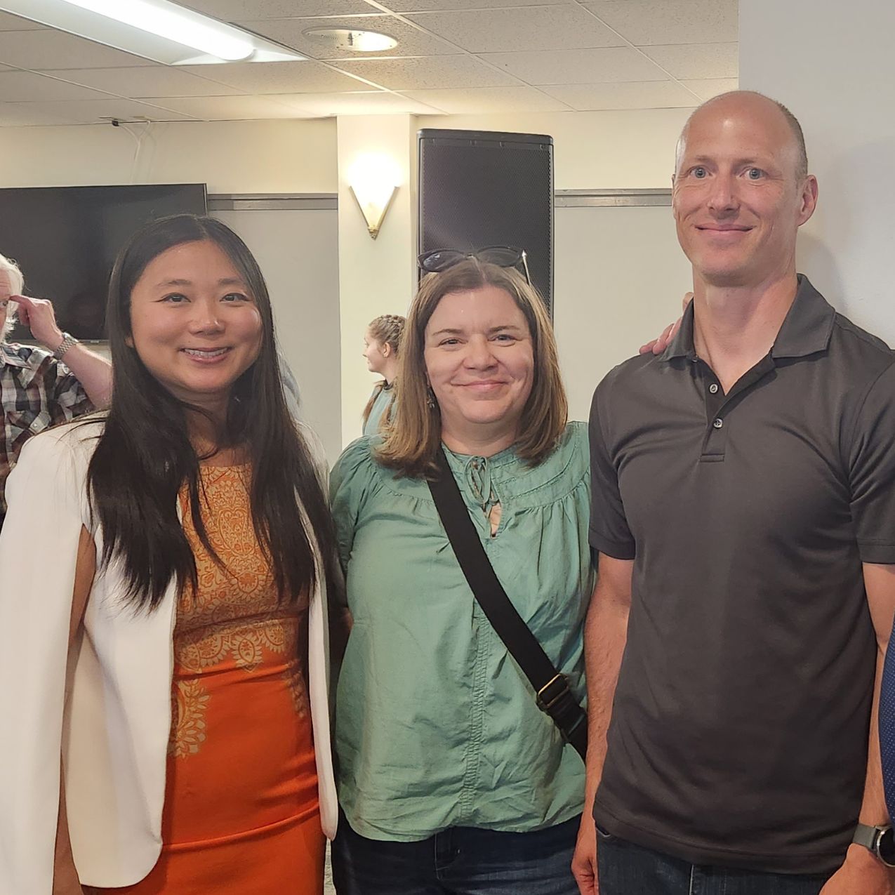 Three faculty members from the Department of Psychology stand next to each other and smile