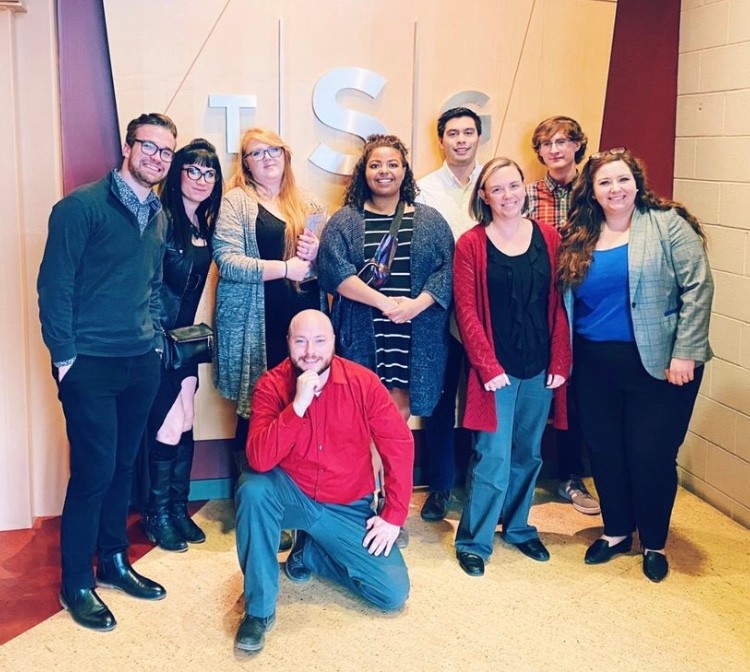 ISU's NSAC team poses against a wall.