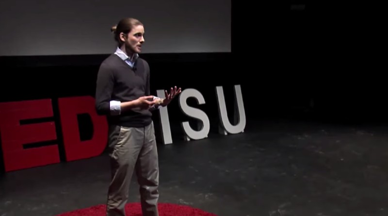 Evan Rodriguez presents onstage at ISU's TEDx event.