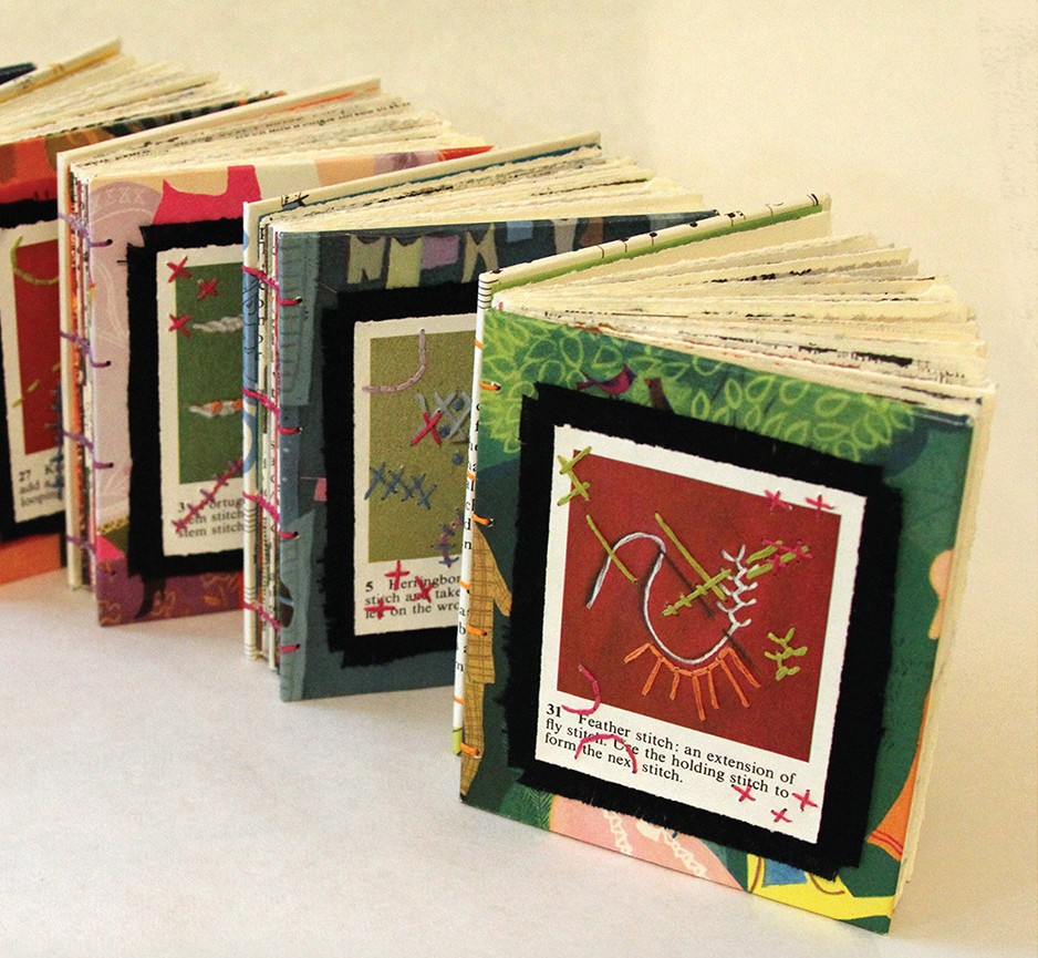 A line of five artists books by Naomi Velasquez.