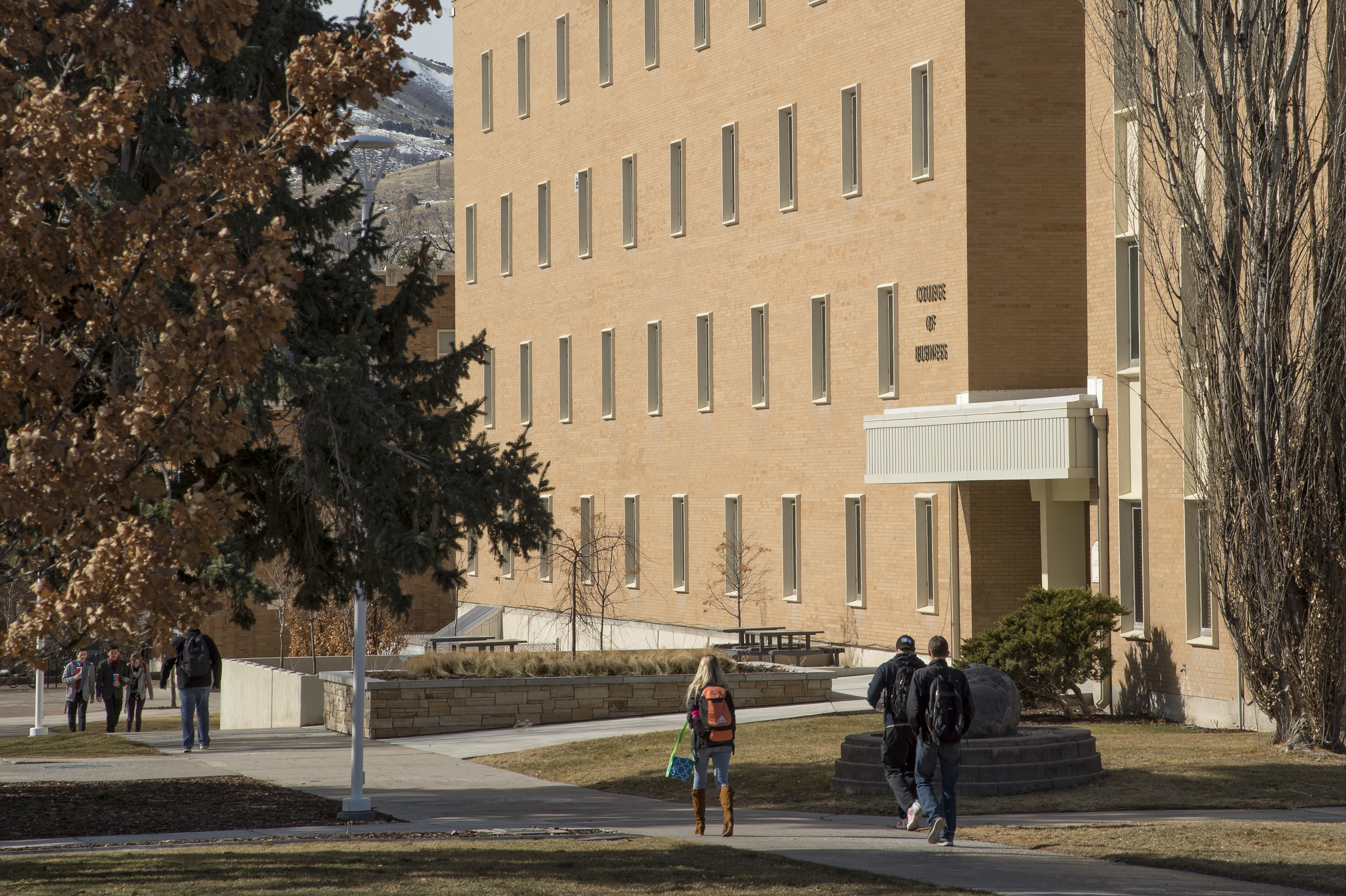 Students walking on the Quad outside of the College of Business