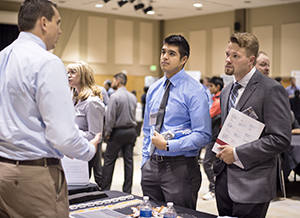 Students meeting professionals at a career fair