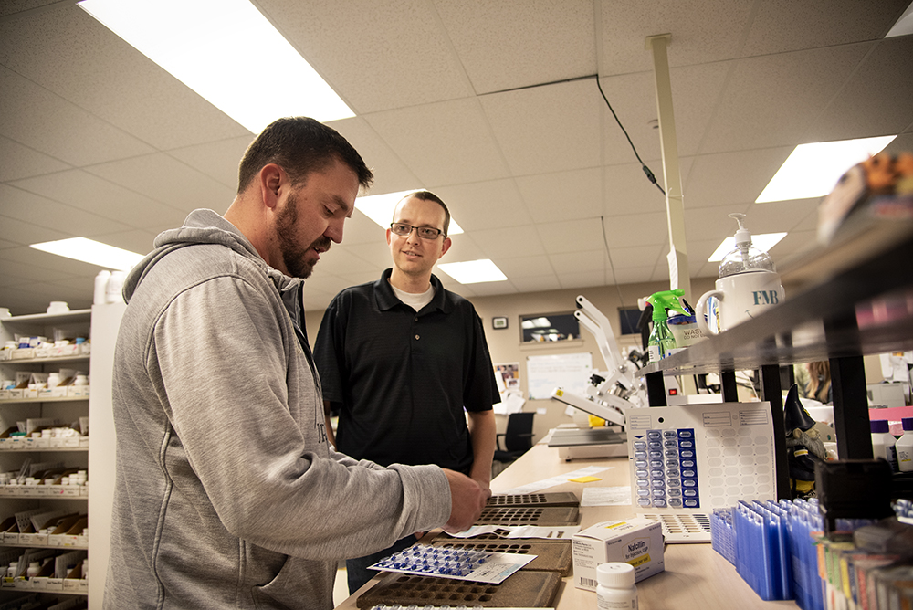 Student working in a pharmacy