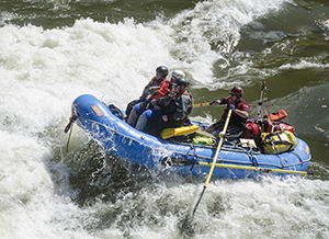 A group doing whitewater rafting