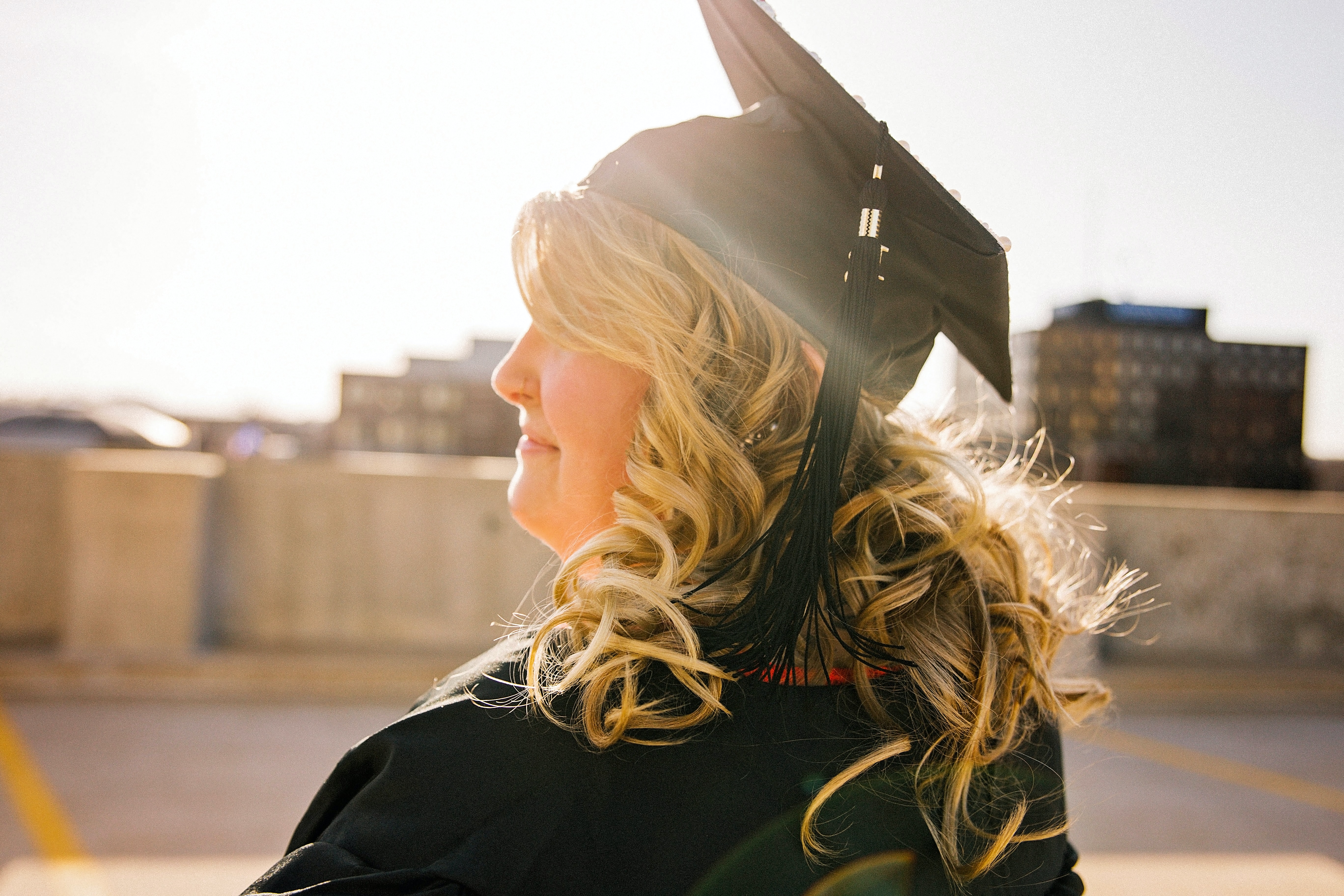 Graduating student standing outside