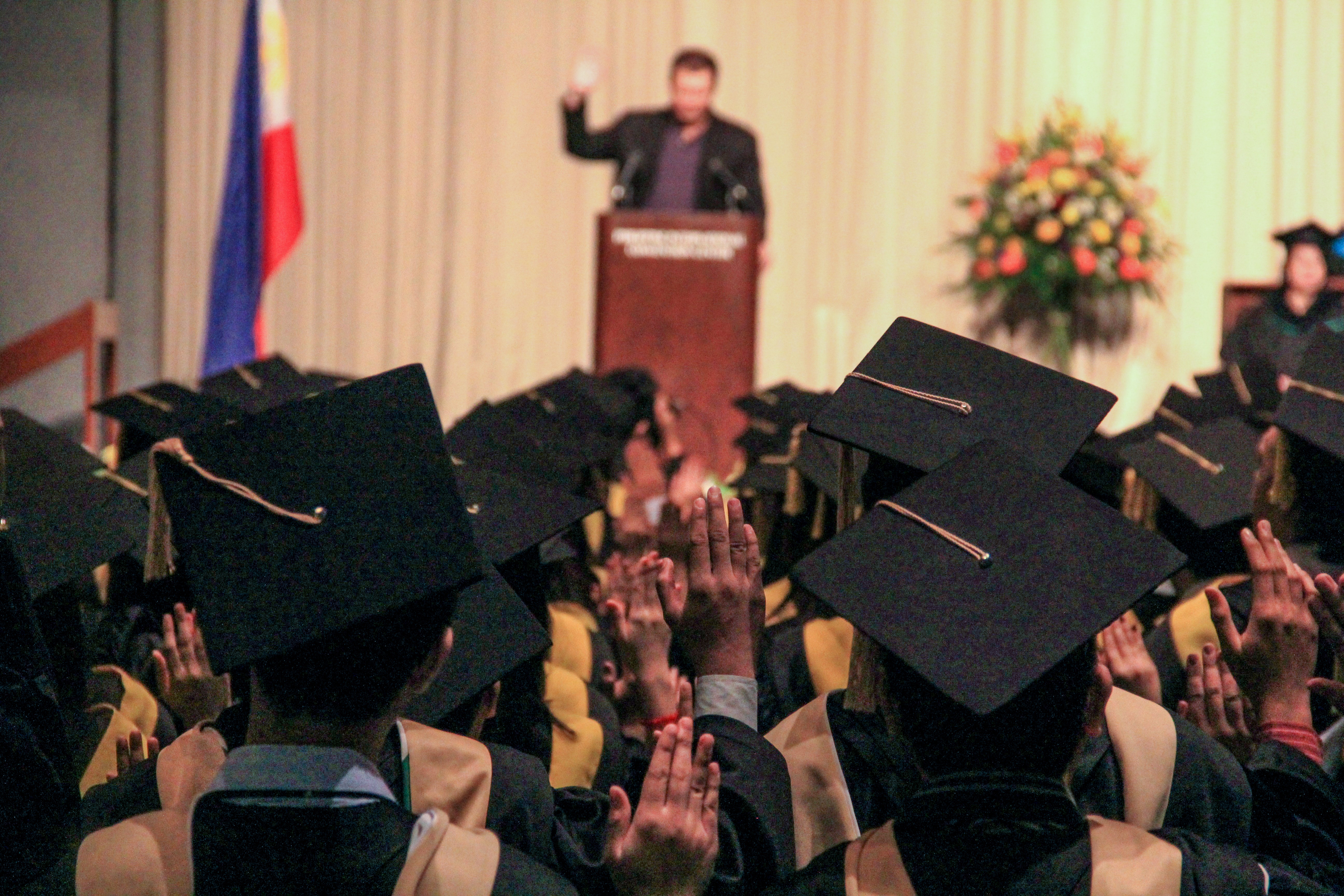 Person publicly speaking at a podium