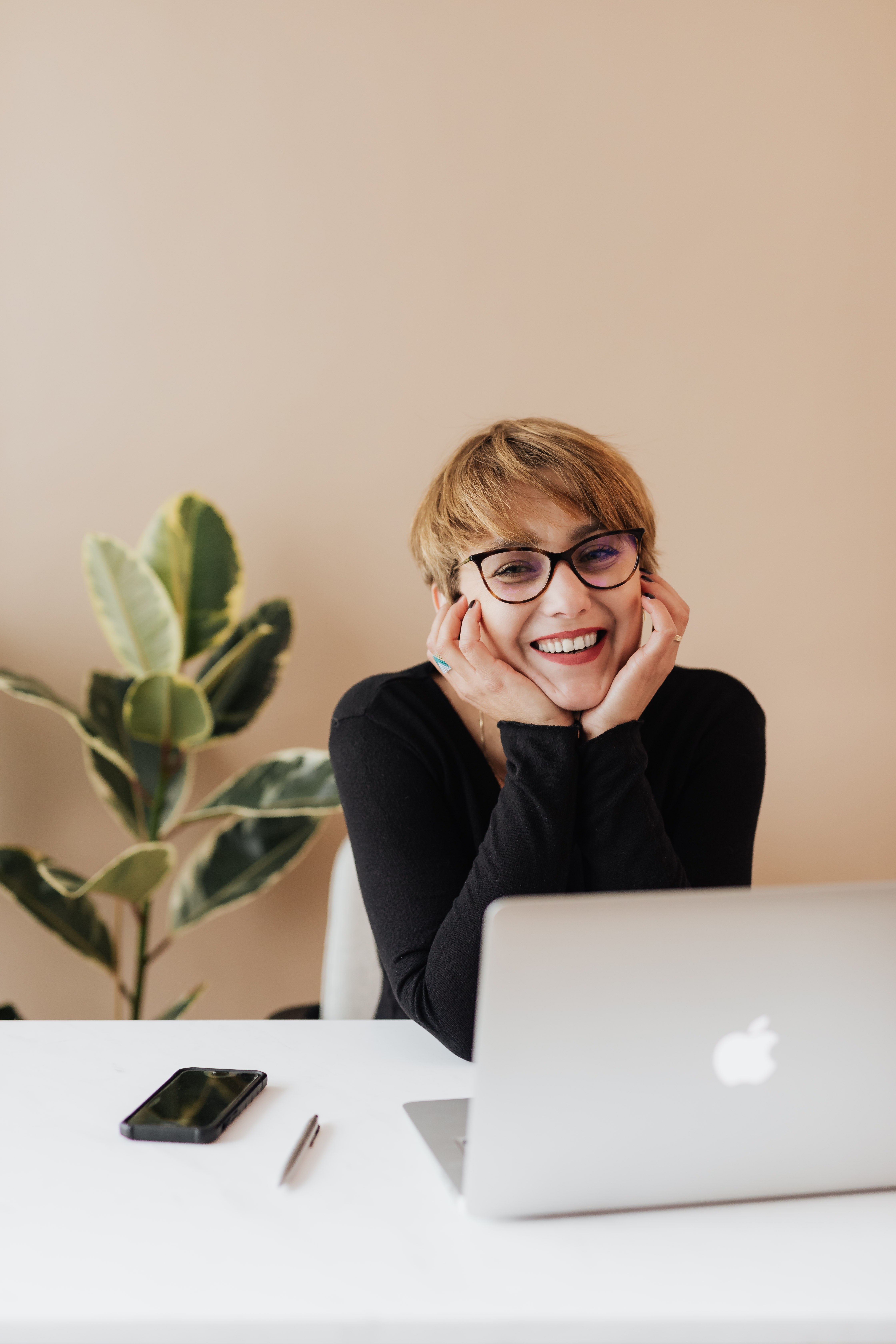 Person smiling at her laptop