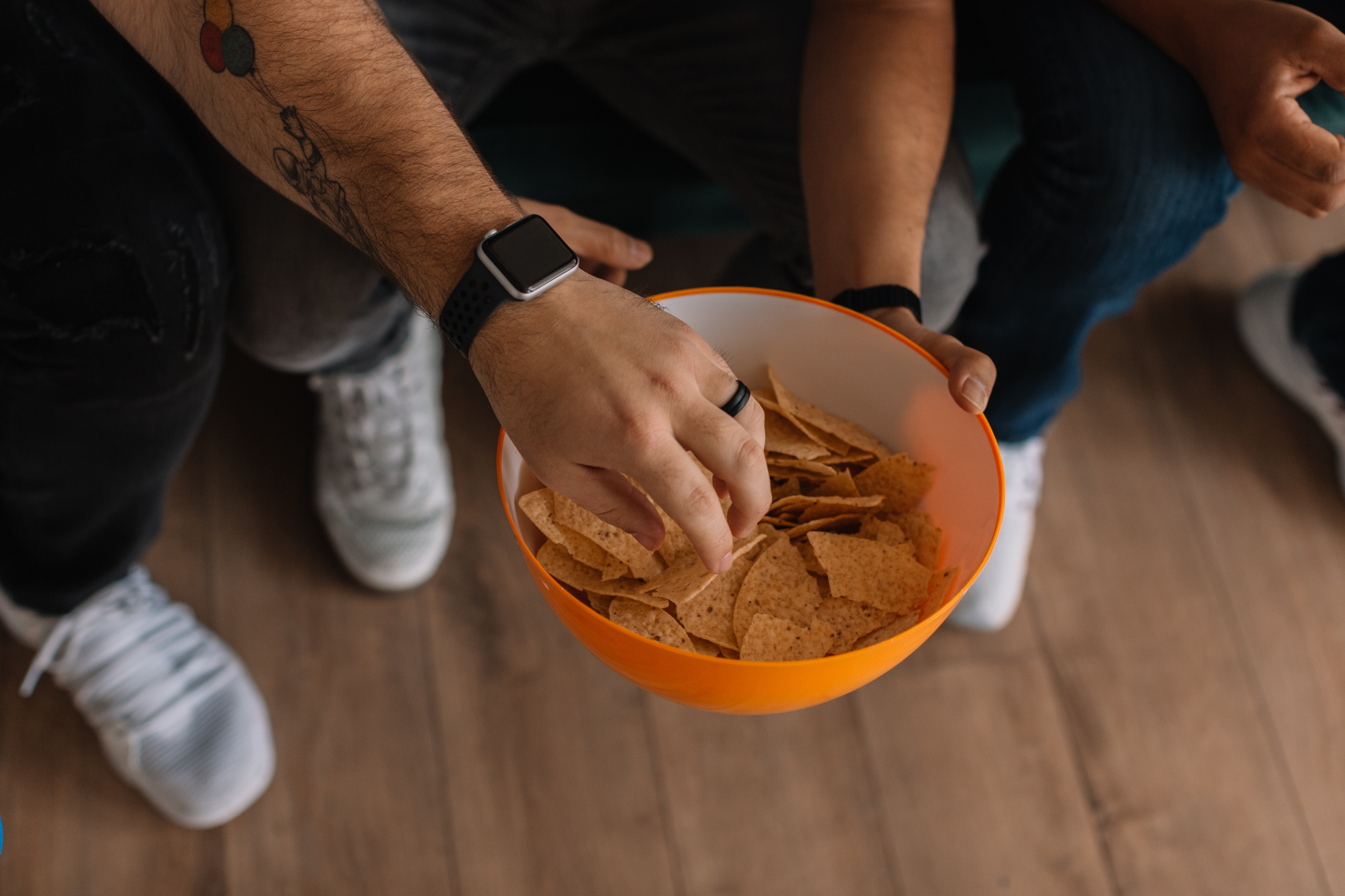 People eating food at a super bowl party