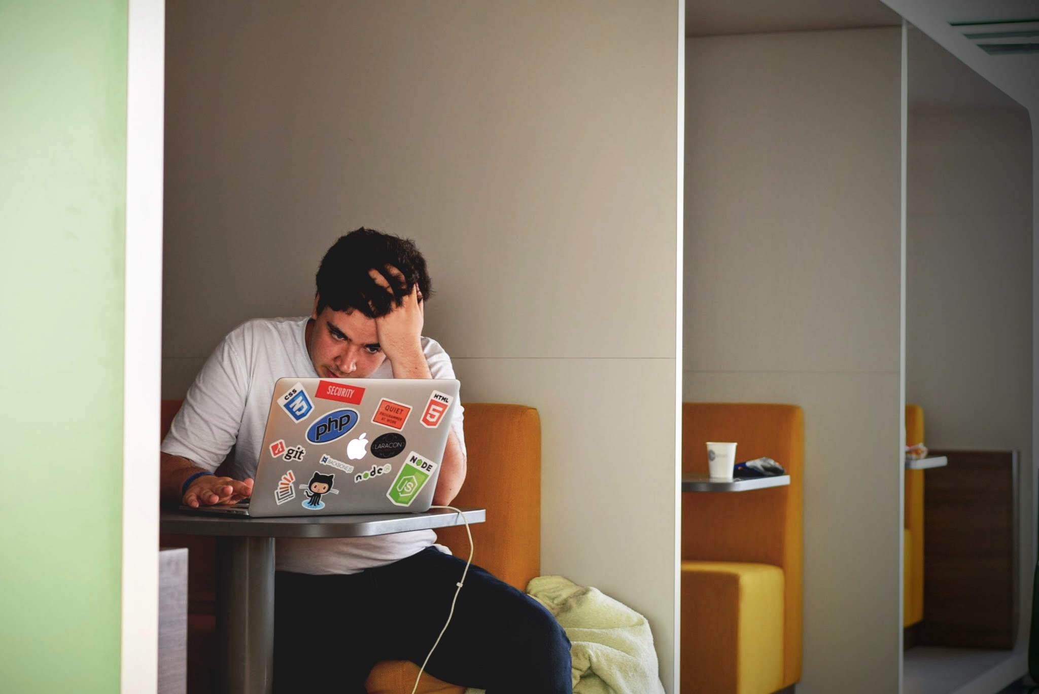 Student studying at a table booth