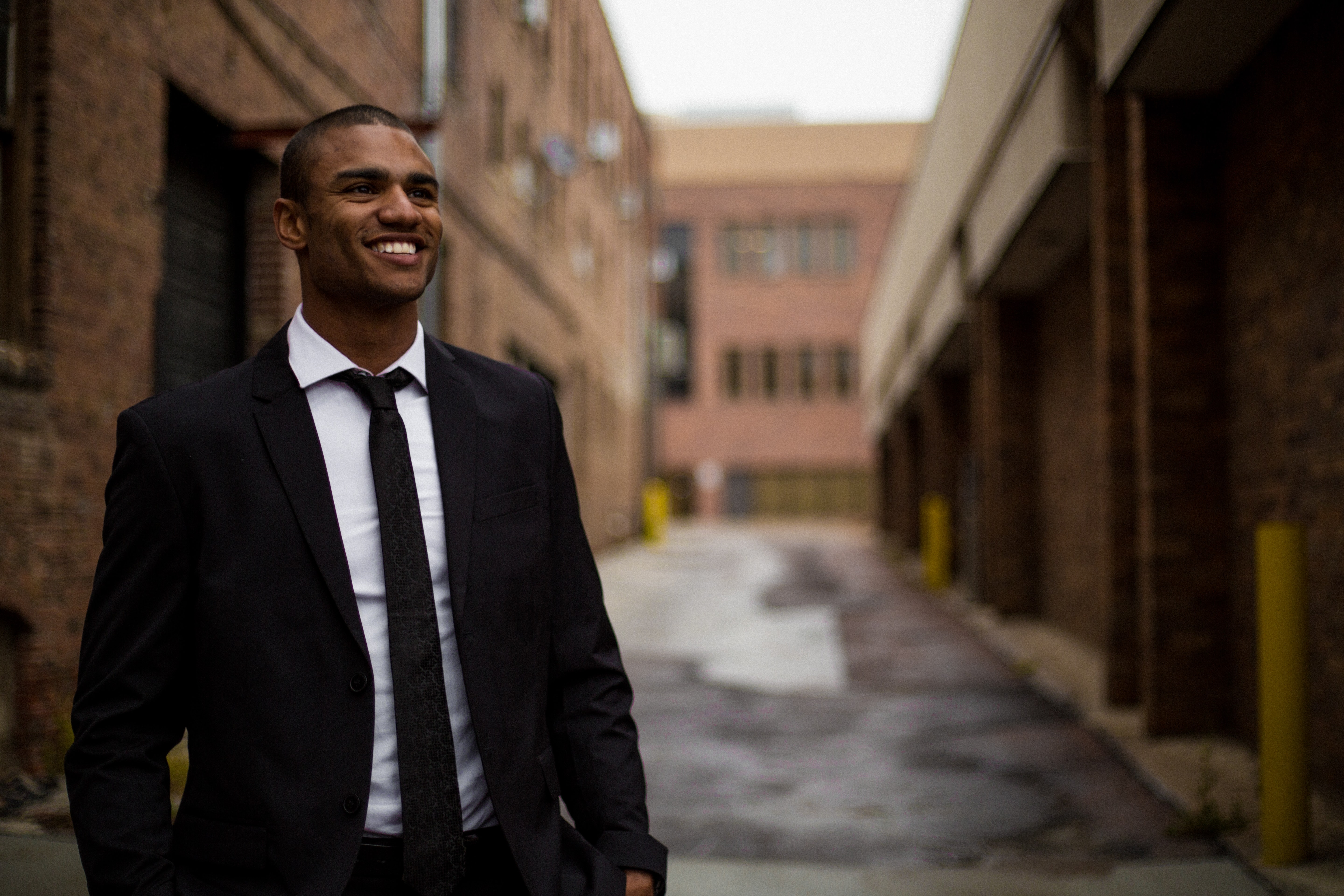 A man walking outside buildings