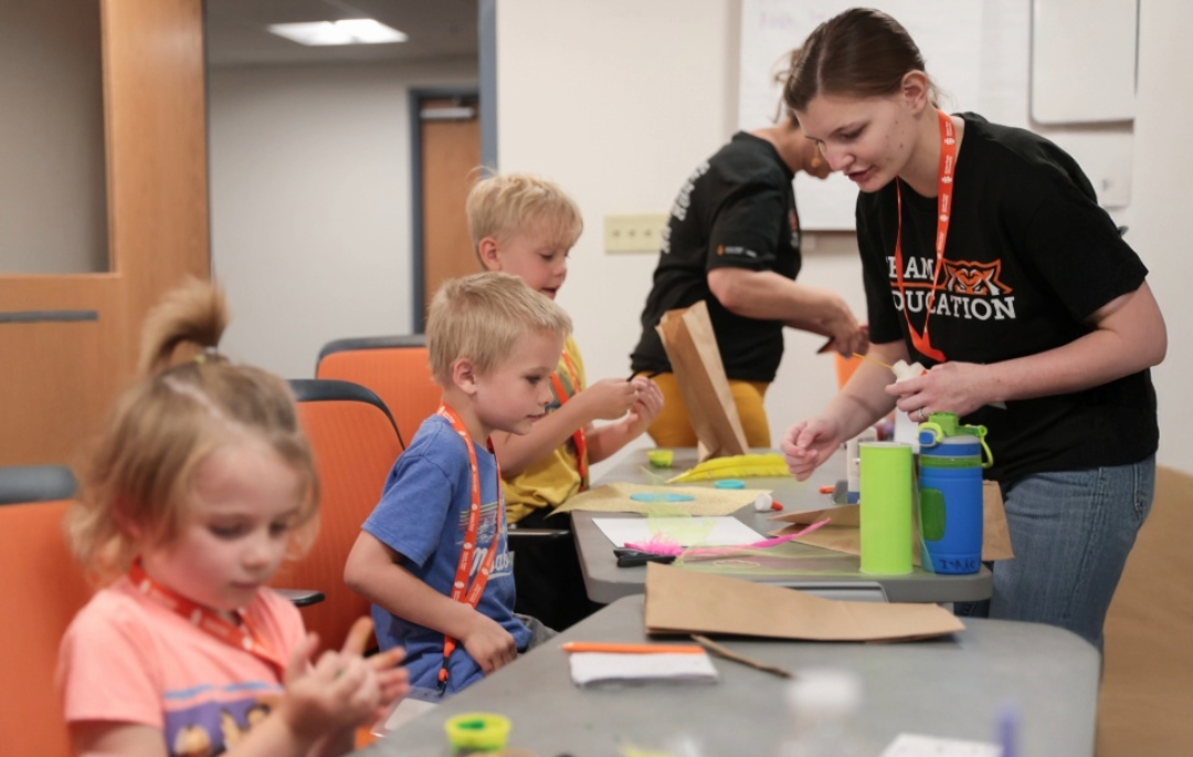 Student teacher doing activities with kids