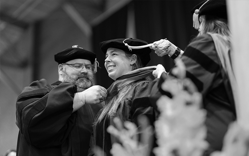 Idaho State University graduate student in the instructional design and technology program is hooded during the ISU commencement ceremony.