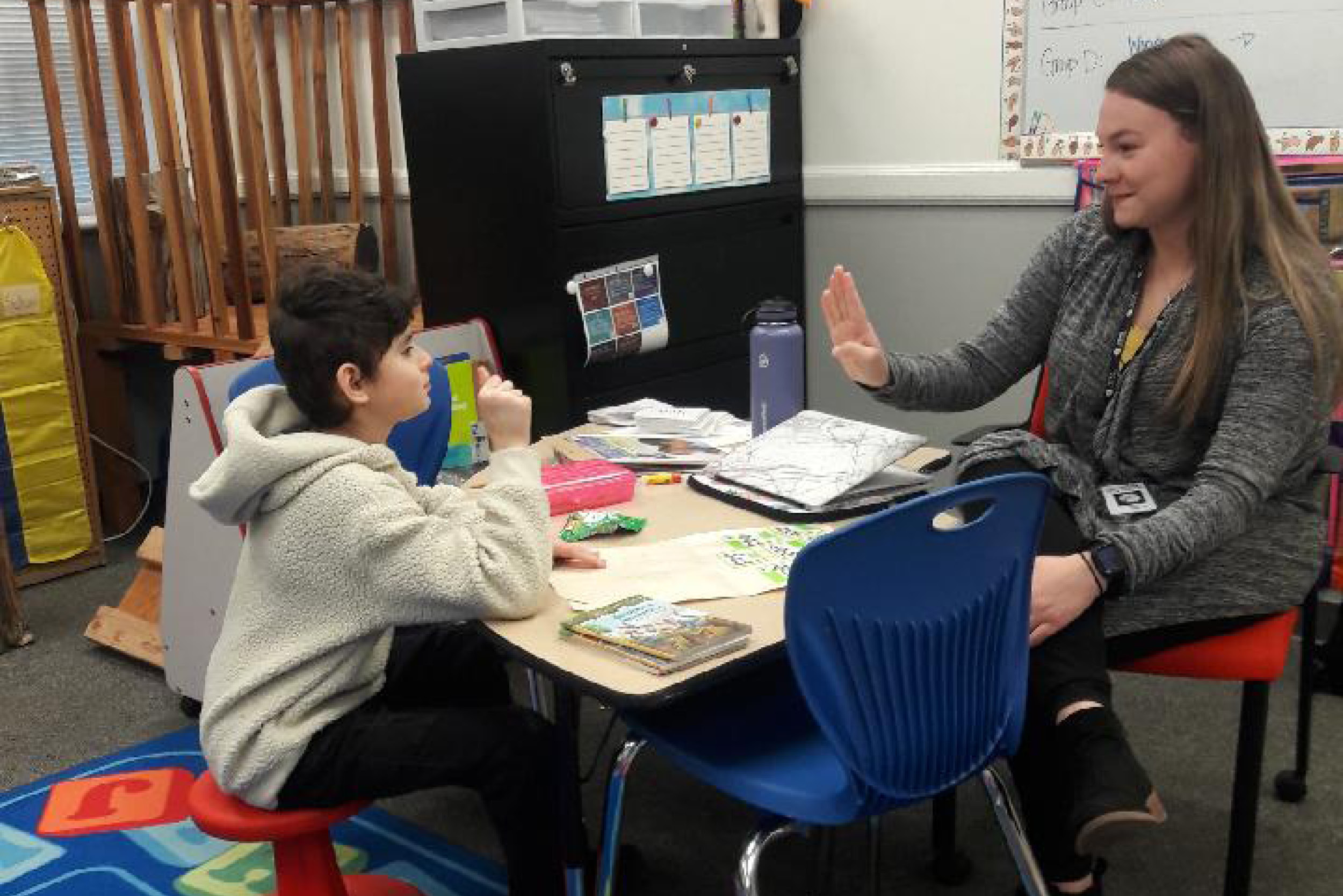 Idaho State University College of Education Deaf/hard-of-hearing Master teacher signs English language to students.