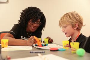 Idaho State University College of Education Master of Art in Teaching candidate teachers elementary students at a science, technology, engineering, and mathematics summer camp.