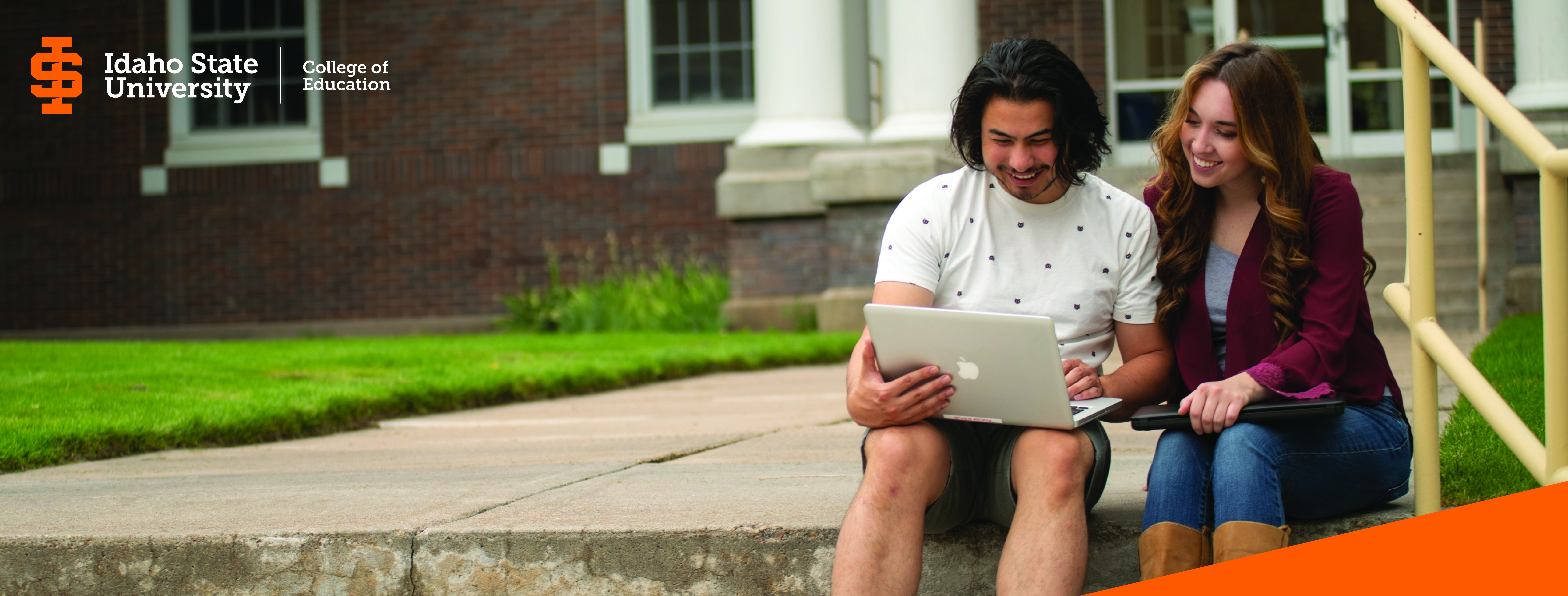 ISU students studying using a laptop on the quad.