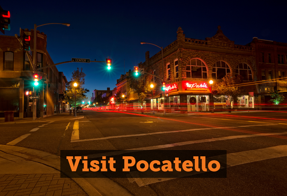 A nighttime photo of Pocatello Center St. Text: Visit Pocatello. Links to Visit Pocatello content
